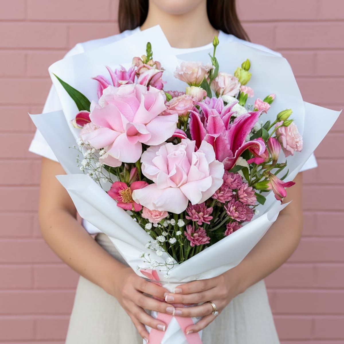 Spoil your Valentine with our Blushing Belle Bouquet! A gorgeous mix of pink garden roses, lilies, and carnations. Order for local delivery in St Albans.